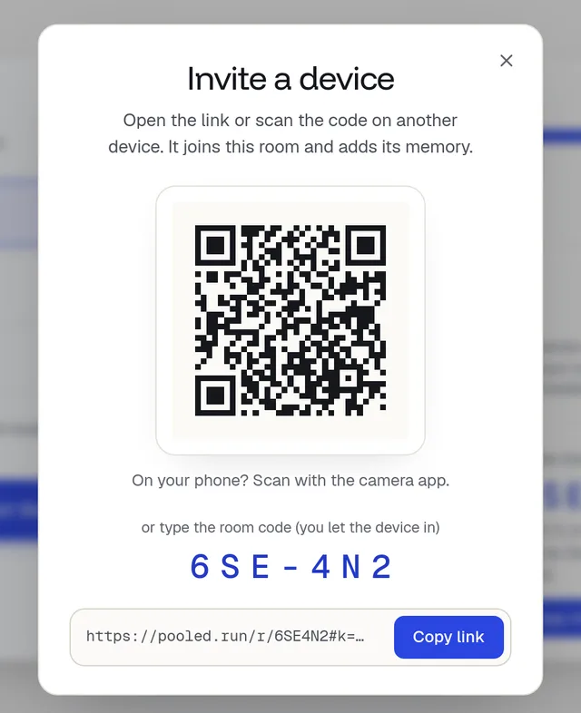The Invite a device sheet: a QR code, the room code and Copy link